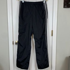 Old Navy black sweatpants with white stripes size medium. Pockets on front/back